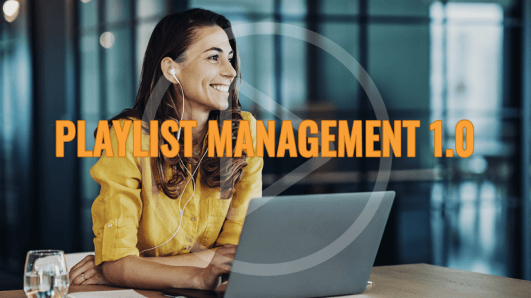 Playlist Management 1.0, Woman smiling as she works on her laptop.